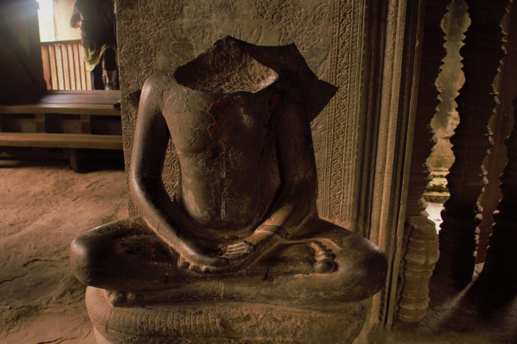 Damaged statue in Angkor Wat
