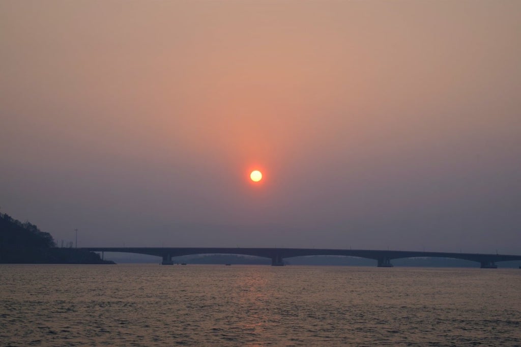 Sun rise above the bridge across the Kali river