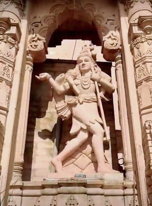Shiva holding body of Sati