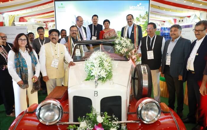 Tourism Director Smt. Sikha Surendran and KTM office bearers at the vintage car displayed by Kerala Tourism at the Wedding and MICE Conclave